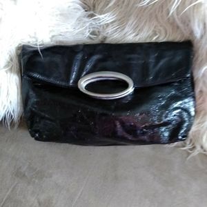 Black patent leather clutch.